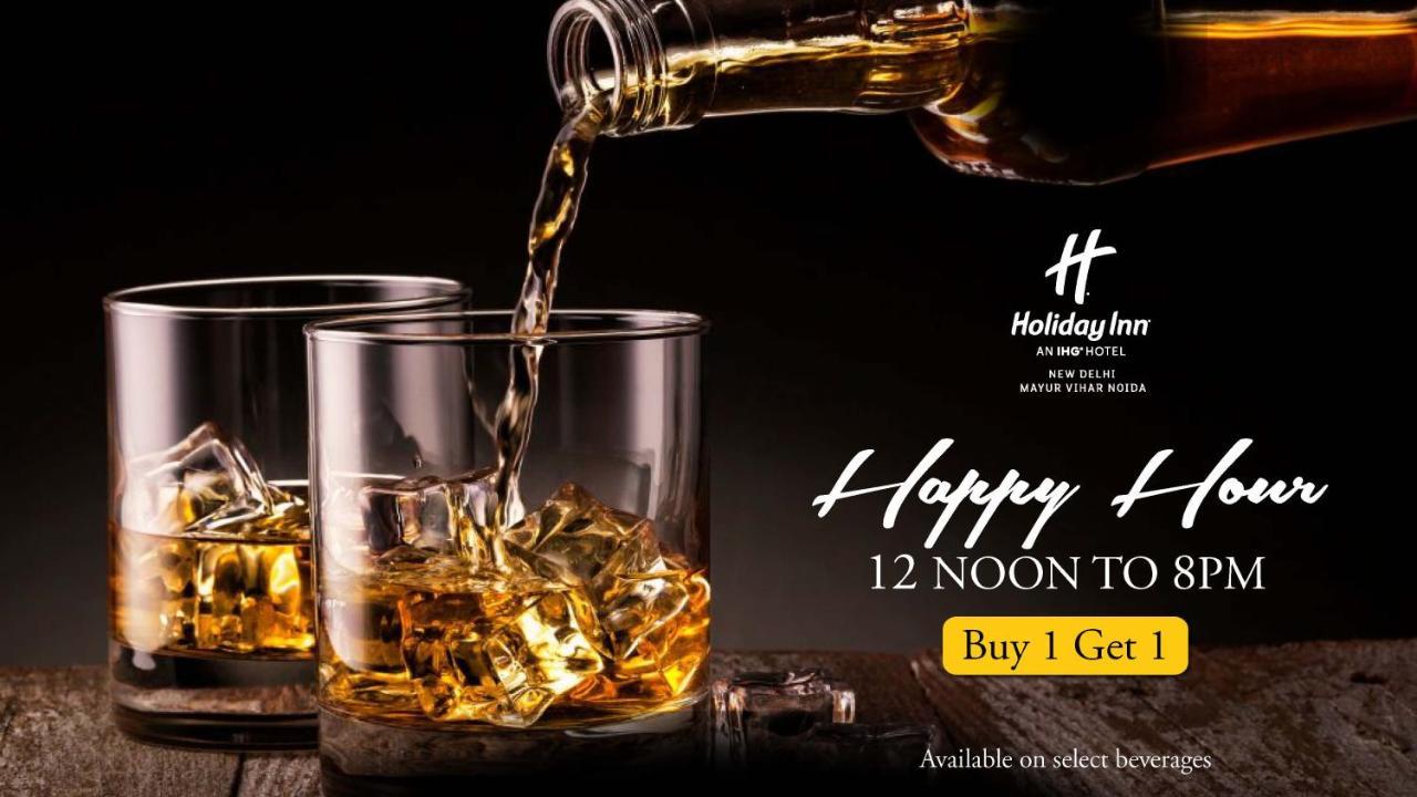 新德里马尤尔维哈尔诺伊达假日酒店 外观 照片 A poster advertising a happy hour